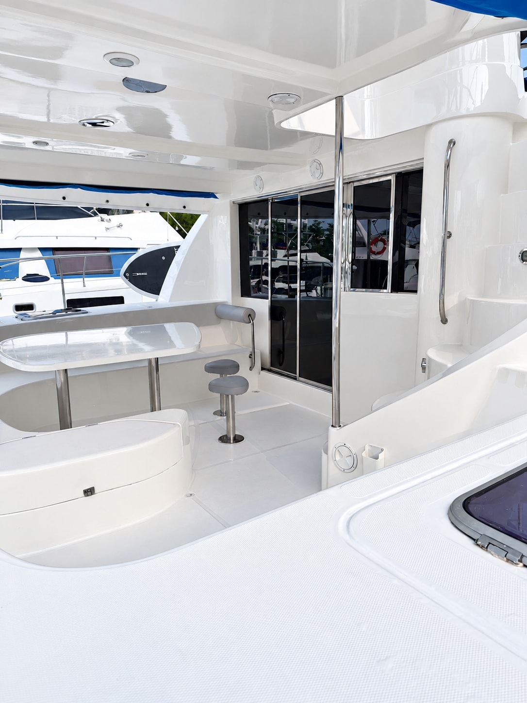 One Lotus yacht — Covered aft-deck seating and dining area