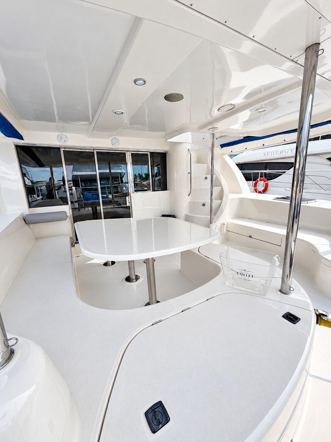 One Lotus yacht — Outdoor dining table and aft-deck seating