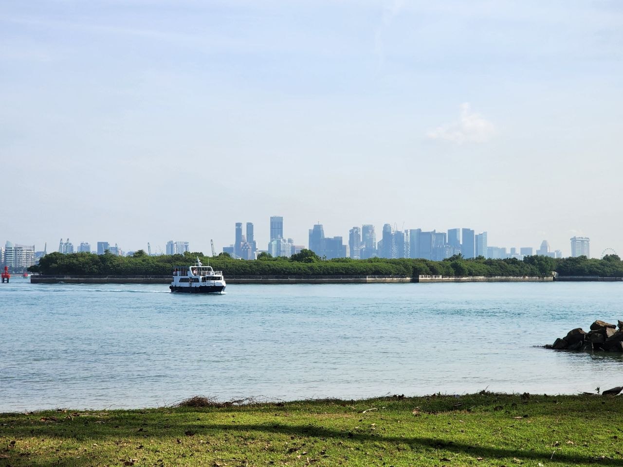Genuine Singapore skyline across the water, photographed from St John’s Island