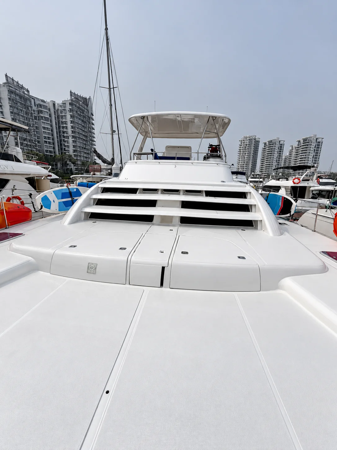 One Lotus foredeck, broad steps and covered flybridge at the marina